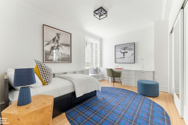 607 W End Ave Unit 4A, New York City, NY 10024 - bedroom with wood finished floors, a desk, and a closet