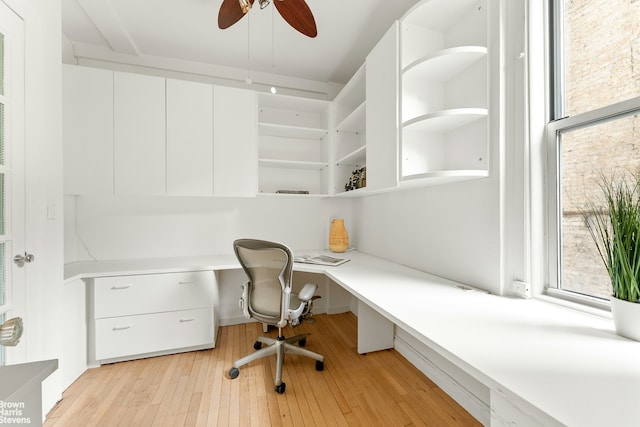 607 W End Ave Unit 4A, New York City, NY 10024 - unfurnished office featuring built in study area, a ceiling fan, and light wood-style flooring