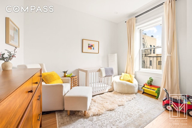 475 Washington Ave Unit 6F, New York City, NY 11238 - bedroom with wood finished floors and a crib