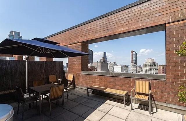 view of patio with a city view and outdoor dining area