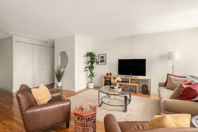 living room with wood finished floors and baseboards