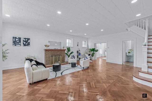 living area with stairs, baseboards, a fireplace, and recessed lighting