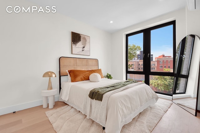 156 Somers St Unit 3B, New York City, NY 11233 - bedroom with wood finished floors, recessed lighting, and baseboards