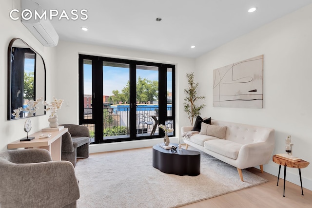 156 Somers St Unit 3B, New York City, NY 11233 - living room featuring a wall mounted AC, wood finished floors, plenty of natural light, recessed lighting, and baseboards