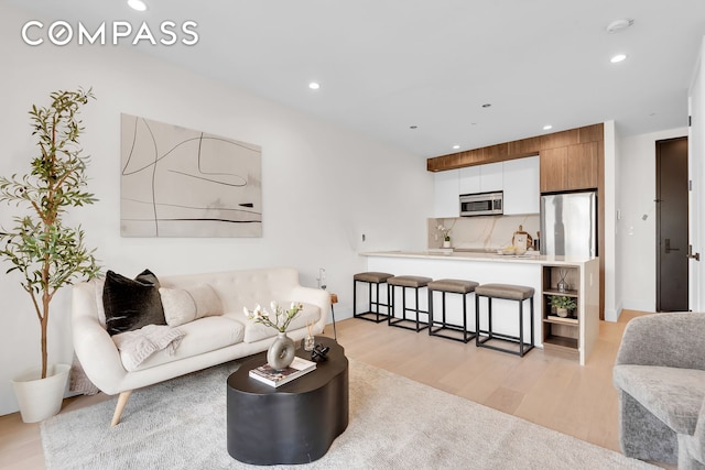 156 Somers St Unit 3B, New York City, NY 11233 - living area featuring light wood-style floors and recessed lighting
