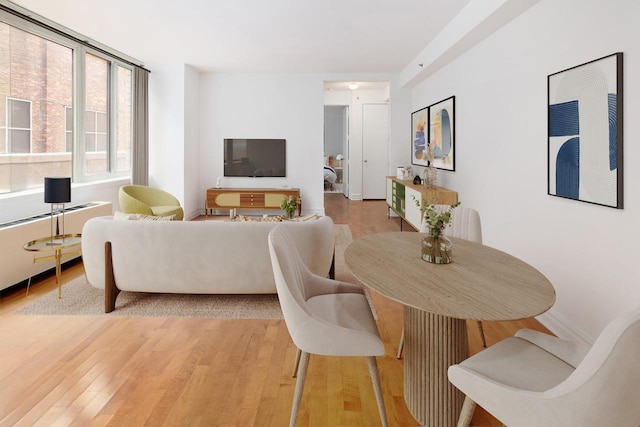 dining area featuring light wood-style flooring