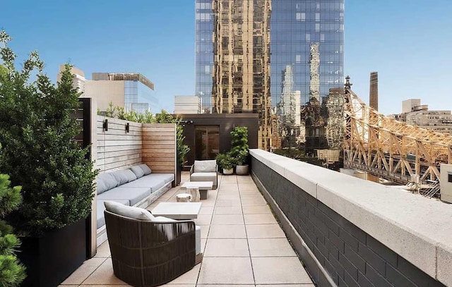 balcony with an outdoor living space and a city view