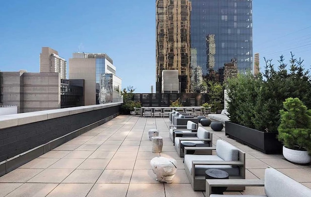 view of patio / terrace featuring a view of city and outdoor lounge area