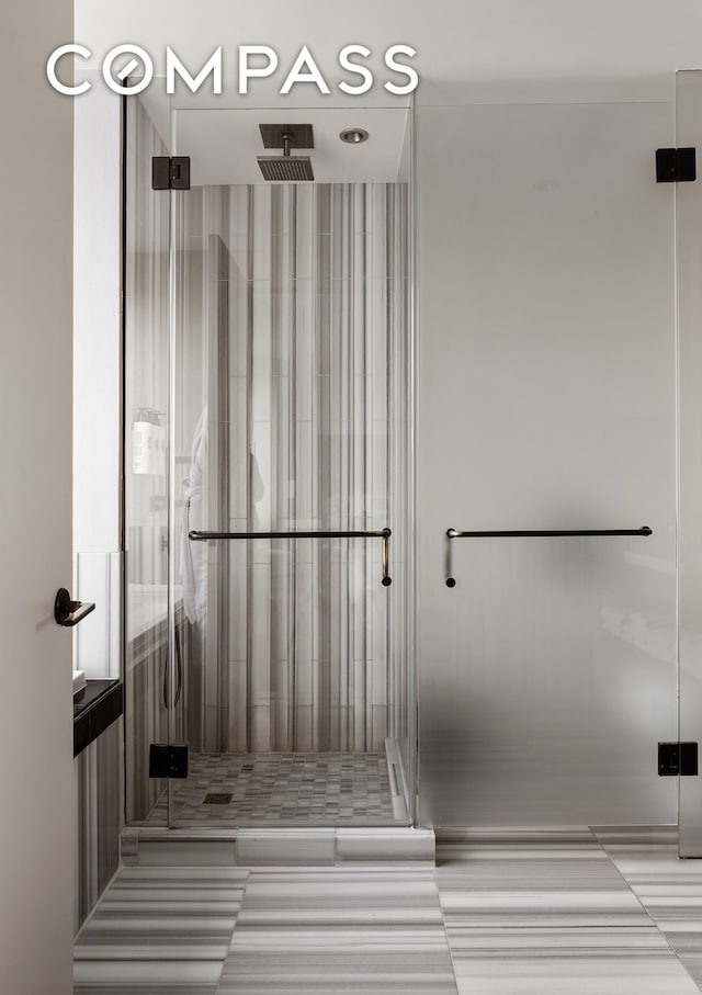 full bath featuring a shower stall