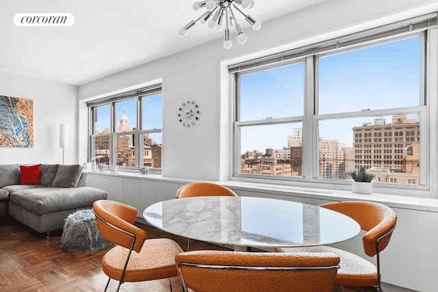 20 E 9th St Unit 18D, New York City, NY 10003 - dining room featuring a view of city, a chandelier, and healthy amount of natural light