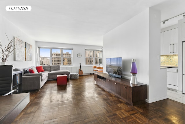 20 E 9th St Unit 18D, New York City, NY 10003 - living room with rail lighting and baseboards