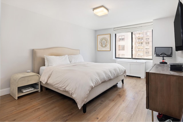 525 E 80th St Unit 9D, New York City, NY 10075 - bedroom with light wood finished floors