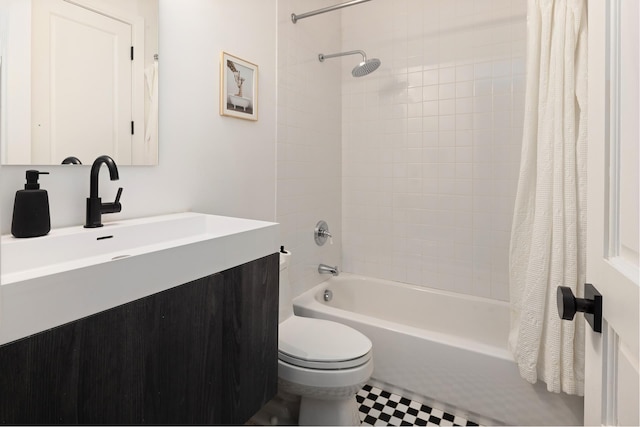 525 E 80th St Unit 9D, New York City, NY 10075 - bathroom featuring shower / tub combo with curtain, vanity, and toilet