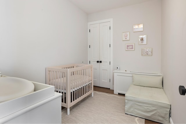 525 E 80th St Unit 9D, New York City, NY 10075 - bedroom with a closet and light wood-style floors
