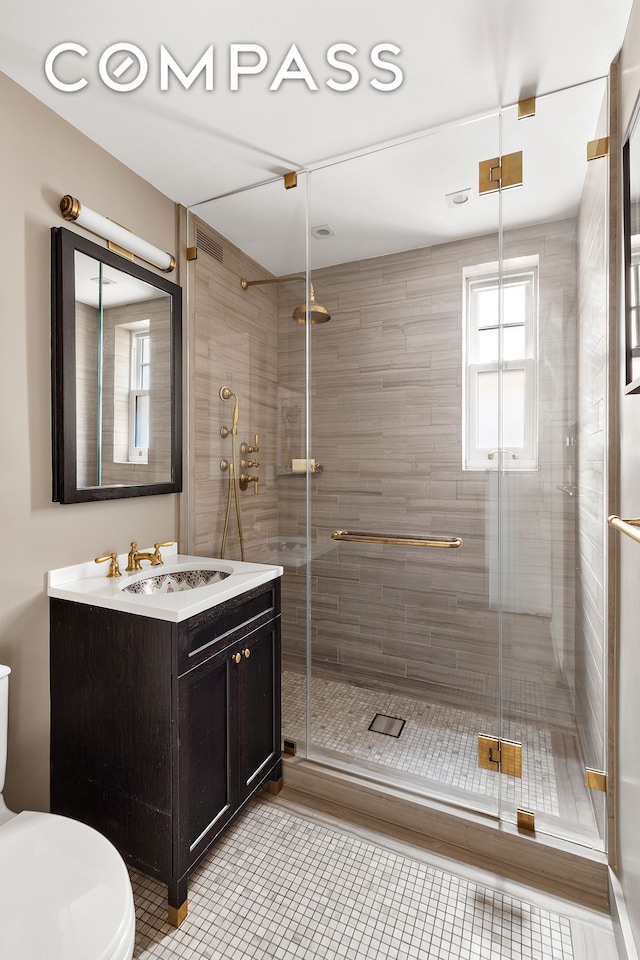 575 Park Ave Unit 1201, New York City, NY 10065 - full bathroom with toilet, vanity, tile patterned floors, and a stall shower