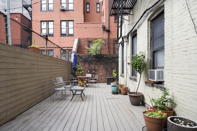64 Macdougal St Unit 15, New York City, NY 10012 - wooden terrace featuring outdoor dining area and cooling unit