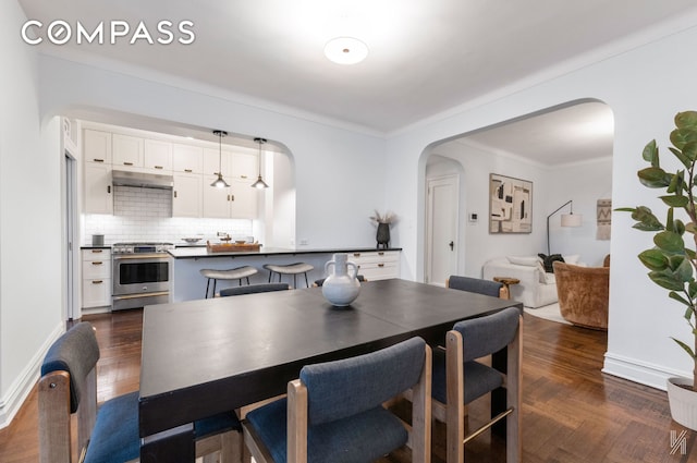 35-06 88th St Unit 5E, New York City, NY 11372 - dining space with arched walkways and baseboards