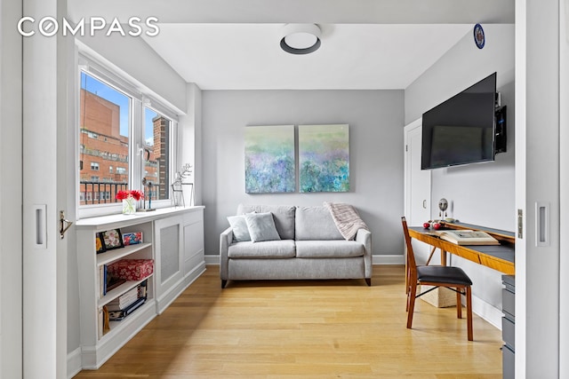 80 E End Ave Unit 17C, New York City, NY 10028 - living room with light wood-style floors, baseboards, and an office area