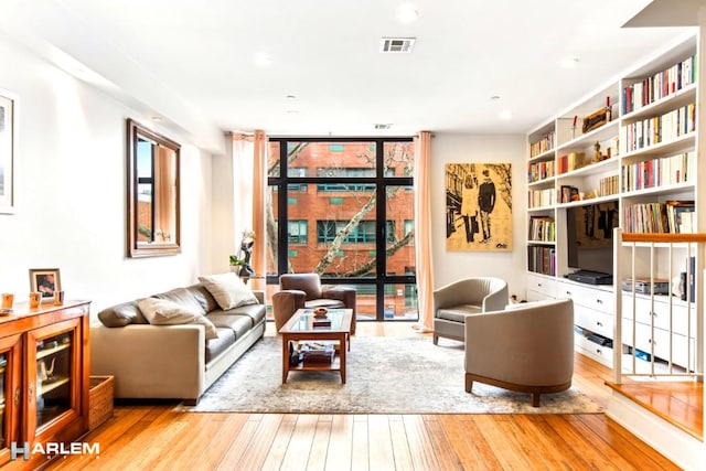 2022 Madison Ave, New York City, NY 10035 - living area with hardwood / wood-style flooring, floor to ceiling windows, and recessed lighting