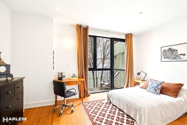 2022 Madison Ave, New York City, NY 10035 - bedroom with access to outside, wood finished floors, baseboards, and recessed lighting