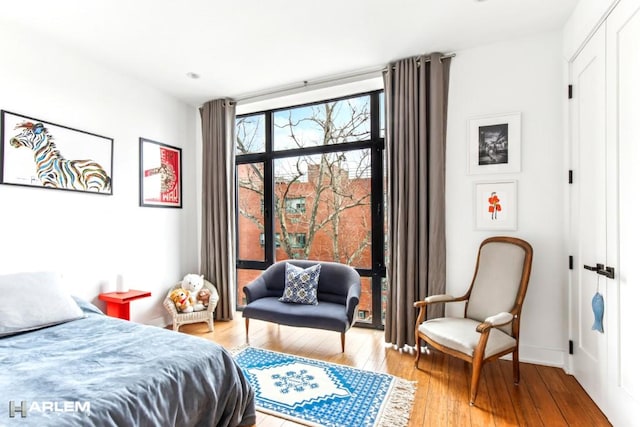 2022 Madison Ave, New York City, NY 10035 - bedroom featuring light wood-style flooring and baseboards