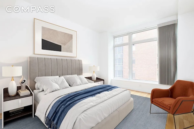 400 E 67th St Unit 7G, New York City, NY 10065 - bedroom featuring wood finished floors