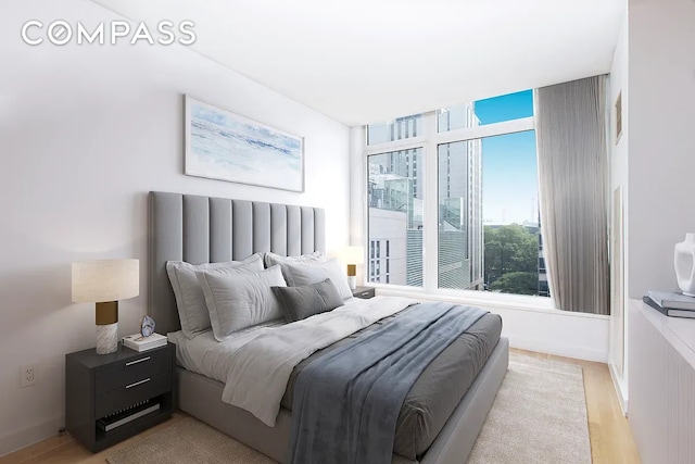 400 E 67th St Unit 7G, New York City, NY 10065 - bedroom with wood finished floors