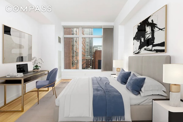 400 E 67th St Unit 7G, New York City, NY 10065 - bedroom featuring wood finished floors