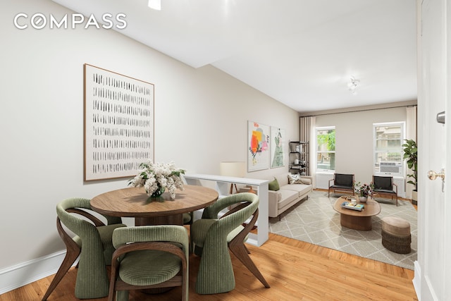 510 E 84th St Unit 1B, New York City, NY 10028 - dining area featuring light wood-style flooring, cooling unit, and baseboards