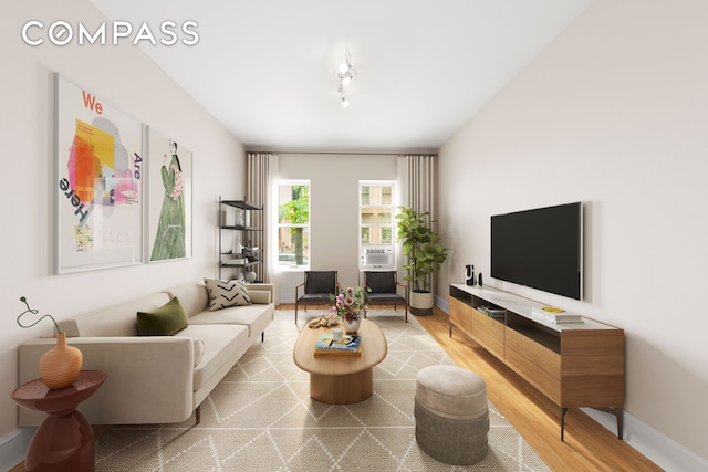 510 E 84th St Unit 1B, New York City, NY 10028 - living area featuring light wood-style floors, cooling unit, and baseboards
