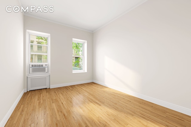 510 E 84th St Unit 1B, New York City, NY 10028 - unfurnished room featuring light wood-style floors, ornamental molding, and baseboards