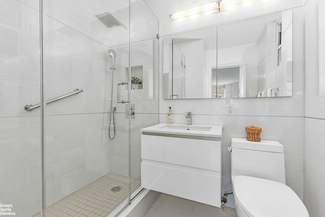501 E 79th St Unit 5A, New York City, NY 10075 - full bath with vanity, a stall shower, toilet, and tile patterned flooring