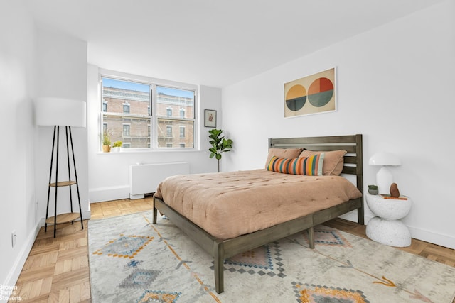 501 E 79th St Unit 5A, New York City, NY 10075 - bedroom with radiator and baseboards