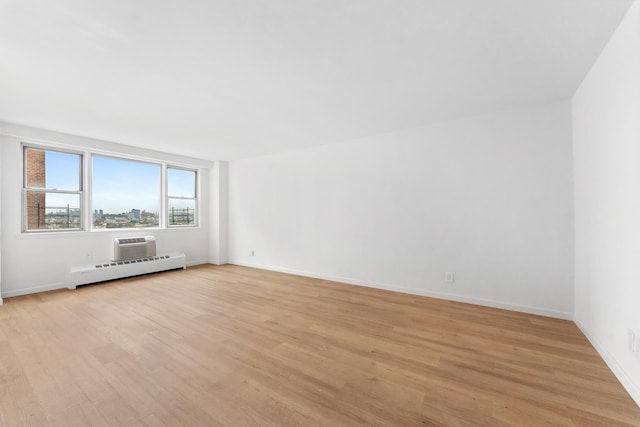 1655 Flatbush Ave Unit B1912, New York City, NY 11210 - unfurnished room with light wood-style floors, baseboard heating, and baseboards