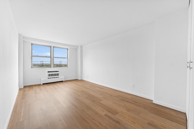 1655 Flatbush Ave Unit B1912, New York City, NY 11210 - spare room with light wood-type flooring, a baseboard heating unit, and baseboards