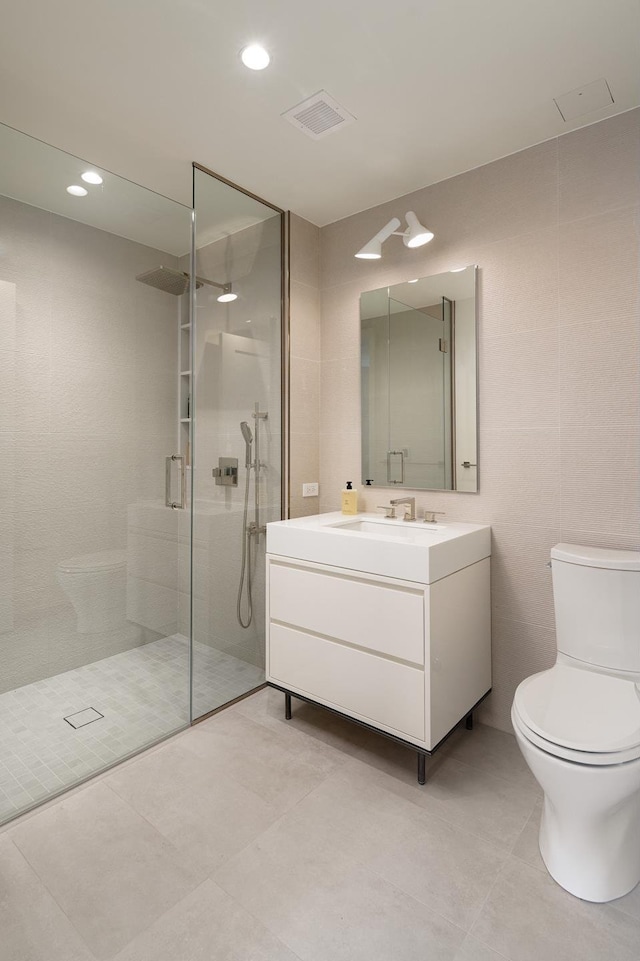 200 E 20th St Unit 5D, New York City, NY 10003 - full bathroom with a walk in shower, toilet, vanity, tile patterned floors, and recessed lighting