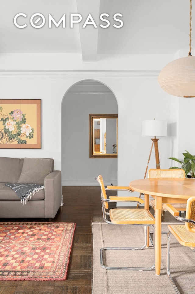 235 W End Ave Unit 8D, New York City, NY 10023 - dining room with arched walkways, dark wood finished floors, and baseboards