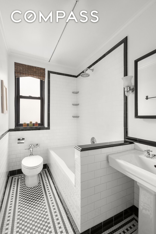 235 W End Ave Unit 8D, New York City, NY 10023 - bathroom featuring tile walls, crown molding, tile patterned flooring, toilet, and a wainscoted wall