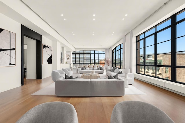 living room with wood finished floors and recessed lighting