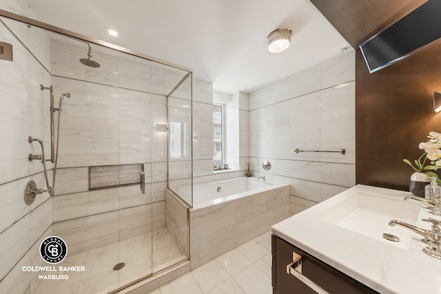 151 E 85th St Unit 17J, New York City, NY 10028 - full bathroom featuring a shower stall, a garden tub, vanity, and tile patterned floors