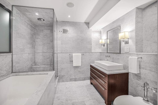 bathroom featuring vanity, a bath, a shower, toilet, and recessed lighting
