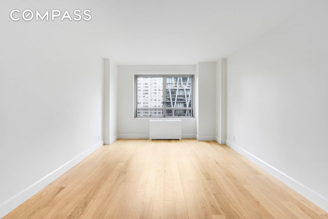 170 W End Ave Unit 12B, New York City, NY 10023 - unfurnished room with wood finished floors and baseboards