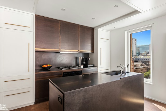 345 W 14th St Unit 8D, New York City, NY 10014 - kitchen with a sink, dark countertops, a kitchen island with sink, plenty of natural light, and recessed lighting