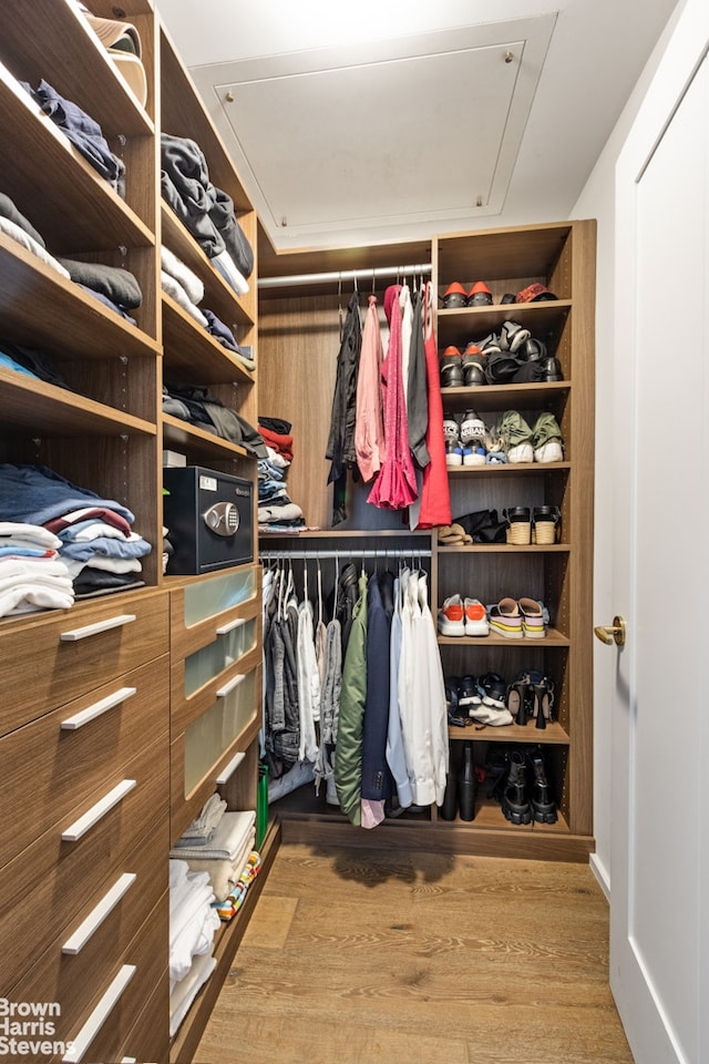 345 W 14th St Unit 8D, New York City, NY 10014 - walk in closet featuring wood finished floors