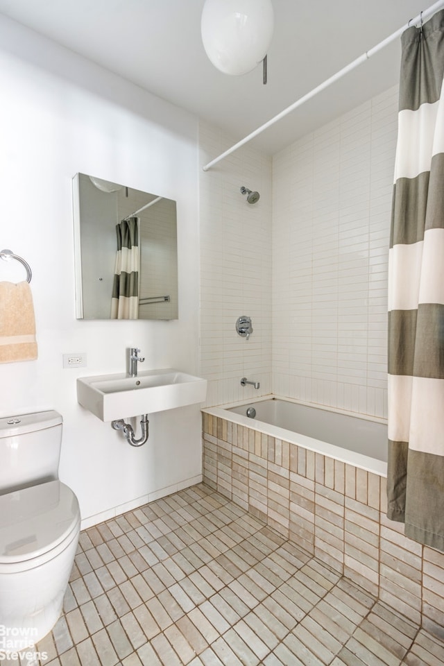 345 W 14th St Unit 8D, New York City, NY 10014 - full bathroom with tiled shower / bath combo, tile patterned floors, and toilet
