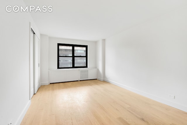 205 W End Ave Unit 15H, New York City, NY 10023 - unfurnished room with wood finished floors and baseboards