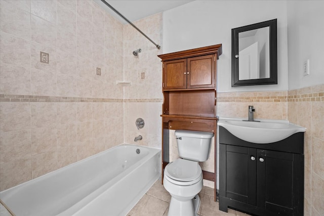 53 Woods Place, New York City, NY 11226 - full bathroom featuring tile walls, toilet, bathtub / shower combination, vanity, and tile patterned floors