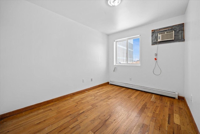 53 Woods Place, New York City, NY 11226 - unfurnished room with a baseboard heating unit, light wood-style floors, baseboards, and a wall mounted air conditioner