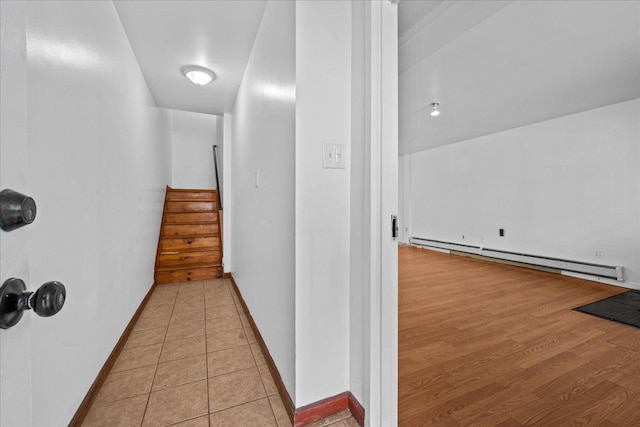 53 Woods Place, New York City, NY 11226 - corridor with a baseboard radiator, baseboards, and stairs