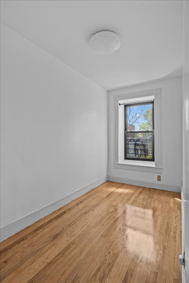 477 Halsey St Unit 4, New York City, NY 11233 - spare room with light wood-type flooring and baseboards